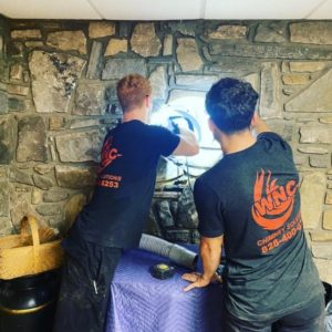Our team of expert Asheville Chimney Repairs repairing fireplace